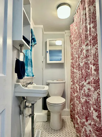 a bathroom with a bathtub and shower