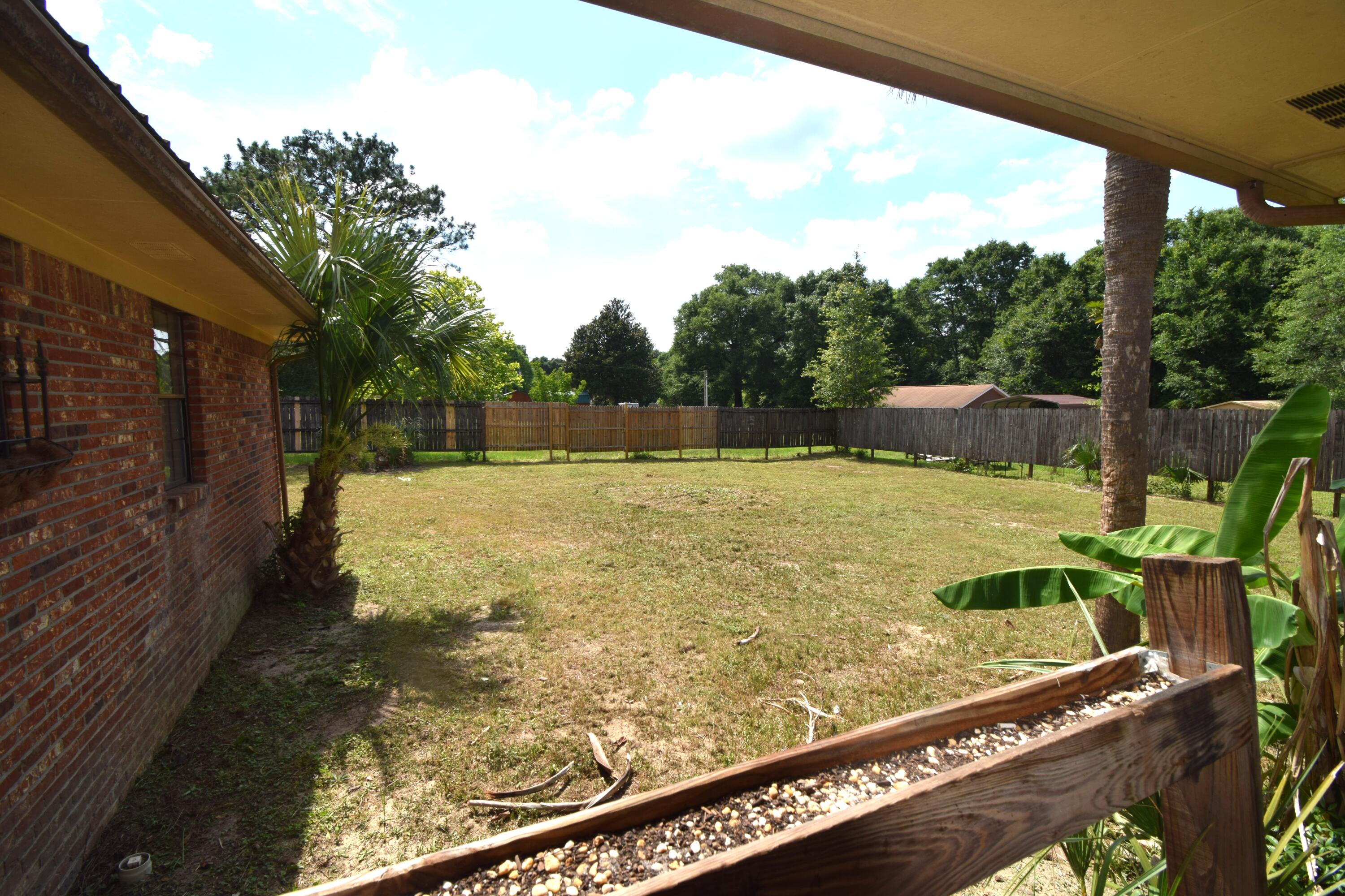 6047 Eden Square Crestview, FL 32539 - Photo 38 of 39 a view of a swimming pool with a patio
