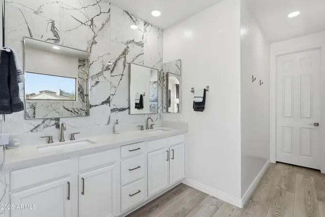 a bathroom with a bathtub and shower