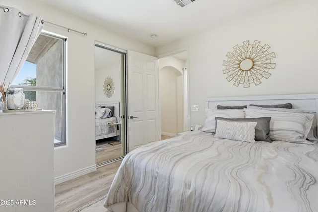 a bathroom with a double vanity sink double mirror and bathtub