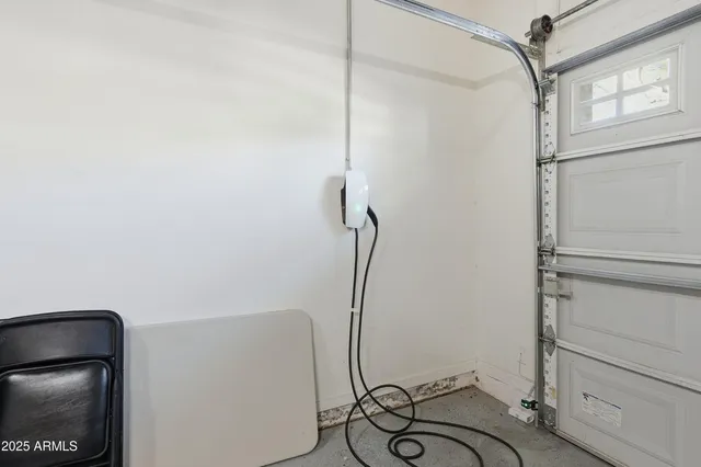 a view of a house with a yard and potted plants