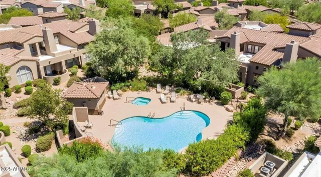 a view of a swimming pool with a patio