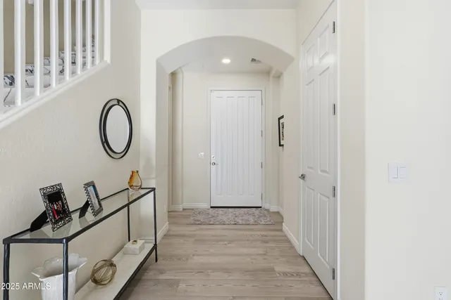 a kitchen with stainless steel appliances a refrigerator and a stove top oven