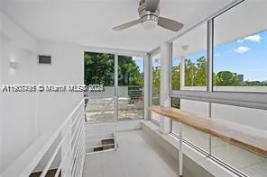 a view of a living room and window