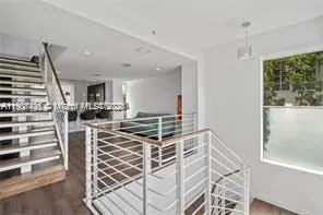 a view of kitchen and dining room with wooden floor