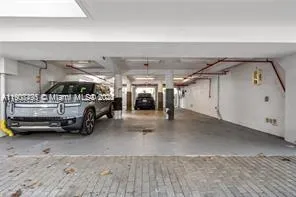 a view of parking area with car parked