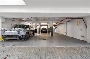 1600 Michigan Avenue, Unit 7 Miami Beach, FL 33139 - Photo 27 of 28 a view of parking area with car parked