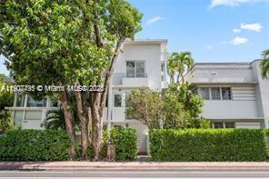 1600 Michigan Avenue, Unit 7 Miami Beach, FL 33139 - Photo 6 of 28 a front view of a house with a garden