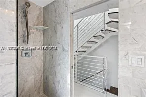 a view of staircase with white walls