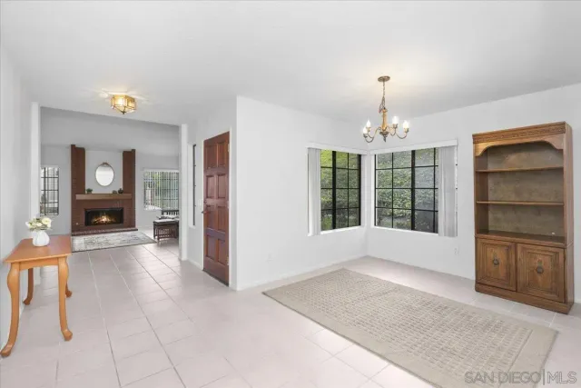 a view of livingroom with furniture cabinet and window