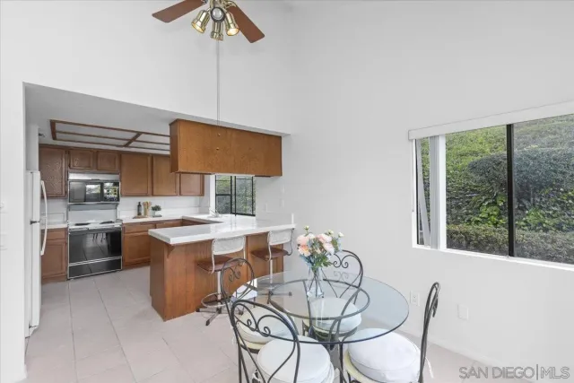 a view of a dining room with furniture window and outside view