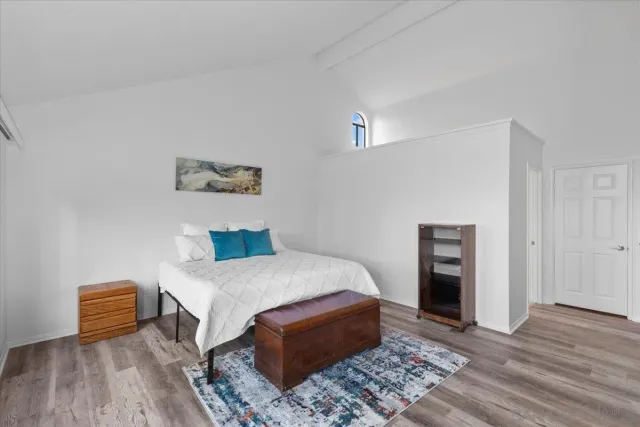 a bedroom with a bed and a table