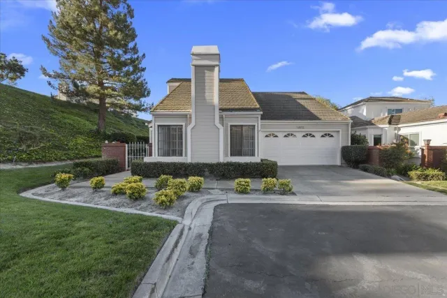 a front view of a house with a yard table and chairs