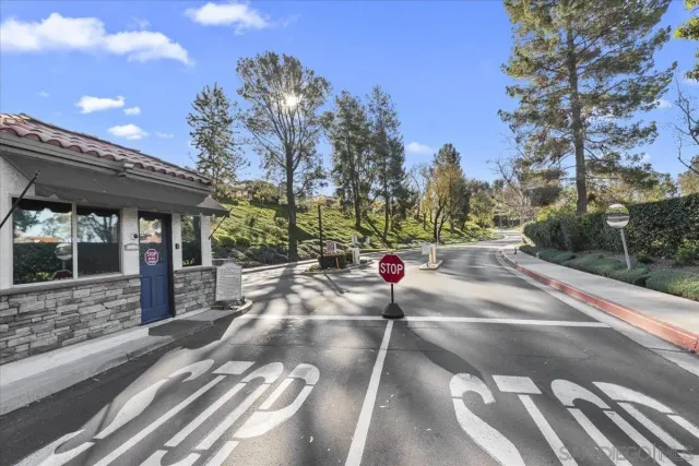 a view of a street with a tree in the background