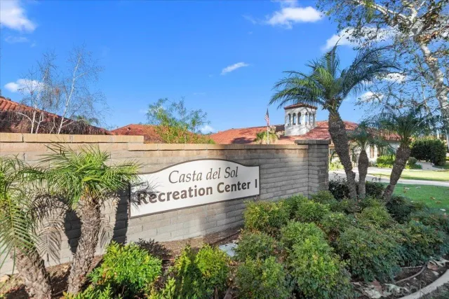 a sign that is on a brick wall