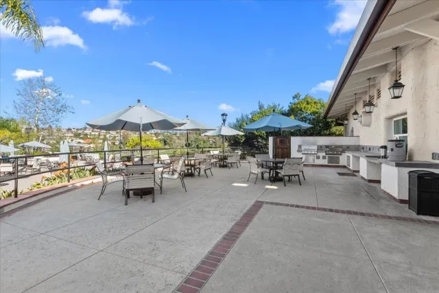 a view of a patio with chairs and tables