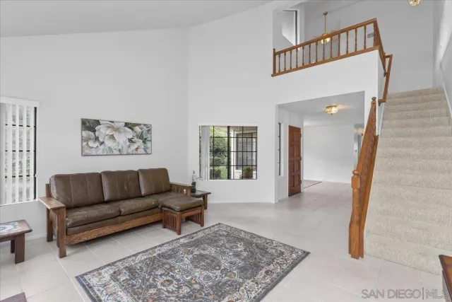 a living room with furniture and a rug