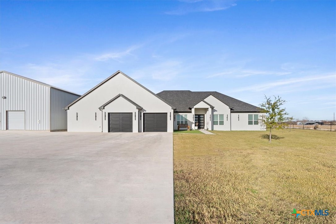 10940 Wedel Cemetery Road Rogers, TX 76569 - Photo 3 of 48 a front view of a house with a yard