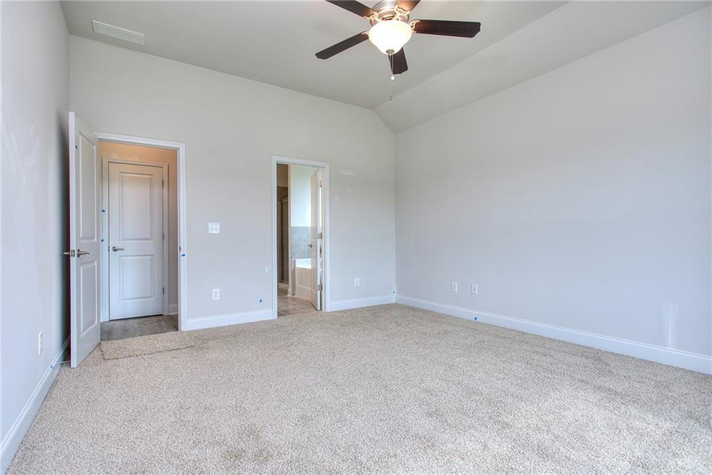 168 Chapman Ridge Road Macon, GA 31211 - Photo 19 of 32 a view of an empty room with a chandelier fan