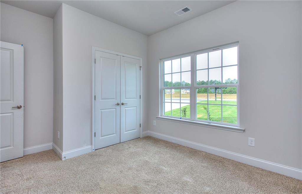 168 Chapman Ridge Road Macon, GA 31211 - Photo 26 of 32 an empty room with windows