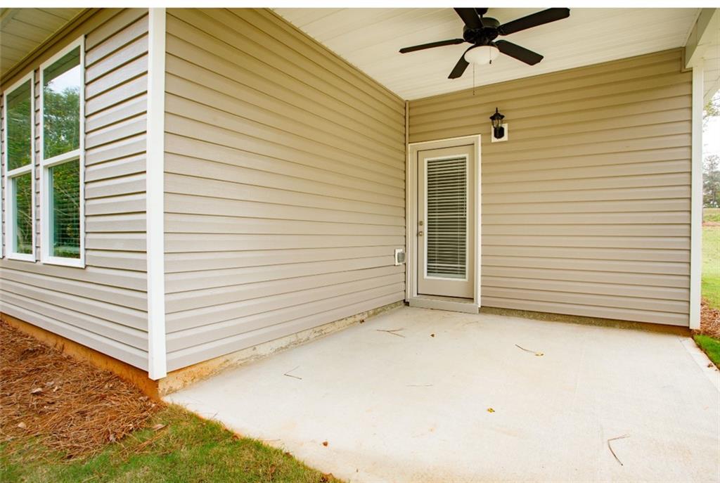 168 Chapman Ridge Road Macon, GA 31211 - Photo 31 of 32 a view of a house with a yard and garage