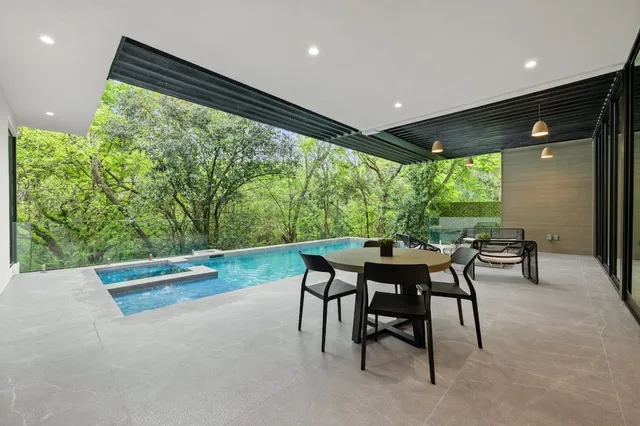 a view of a dining room with furniture window and outside view