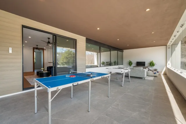 a outdoor dining space with furniture and a potted plant