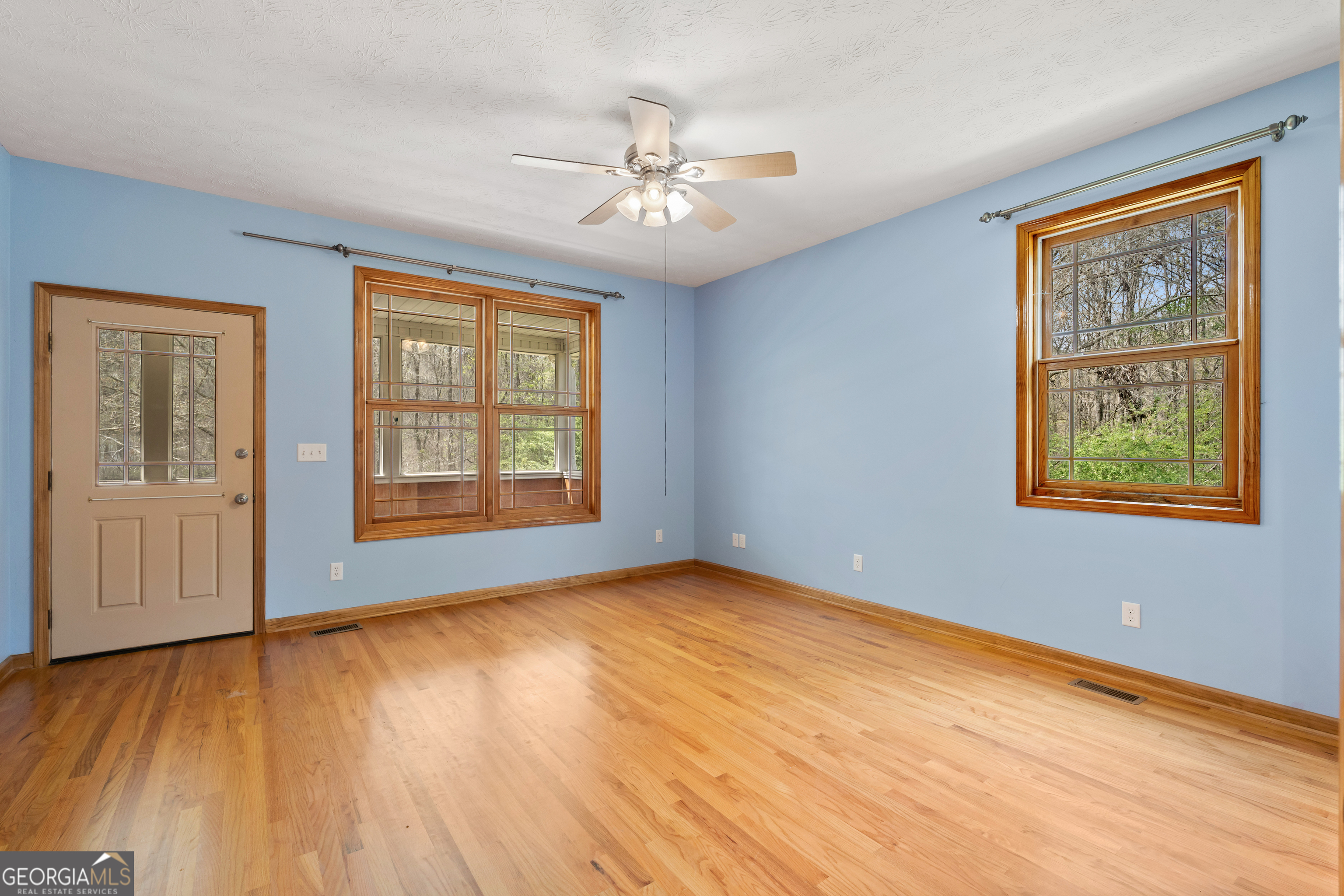 1229 Boggus Road Franklin, GA 30217 - Photo 25 of 68 a view of an empty room with a window and wooden floor