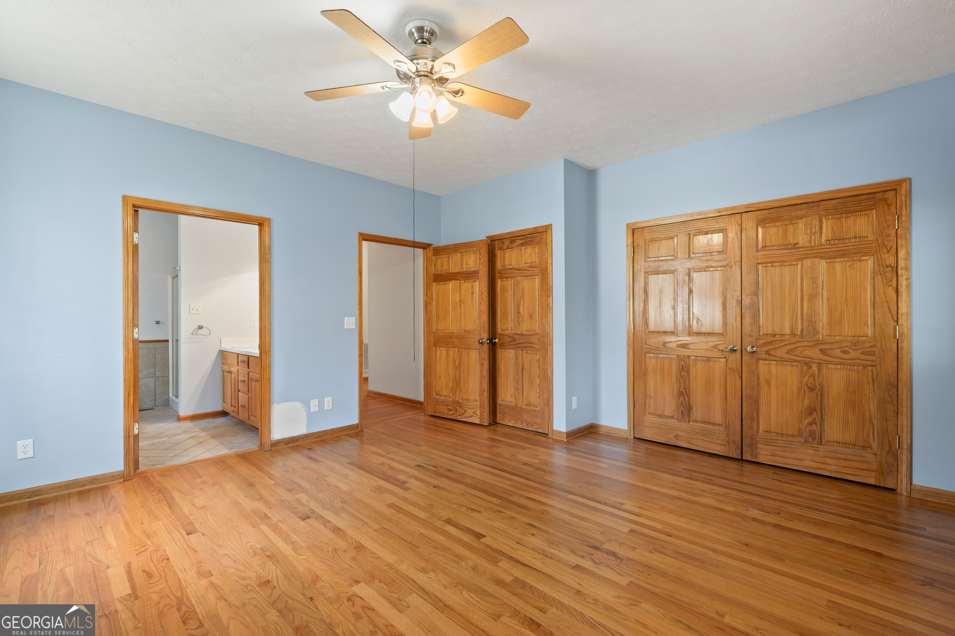 1229 Boggus Road Franklin, GA 30217 - Photo 26 of 68 a view of an empty room with window and wooden floor