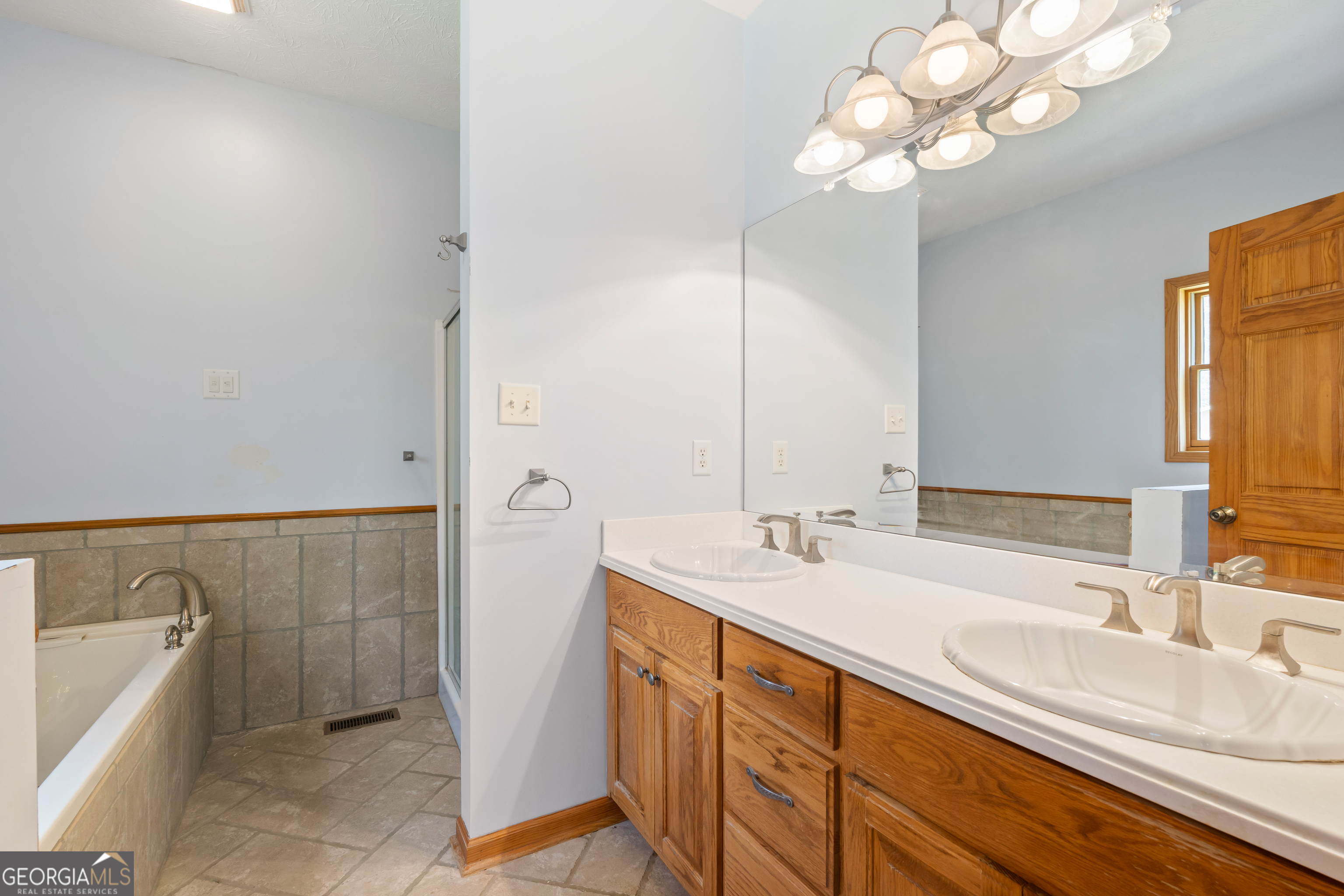 1229 Boggus Road Franklin, GA 30217 - Photo 27 of 68 a bathroom with a sink a vanity and a mirror