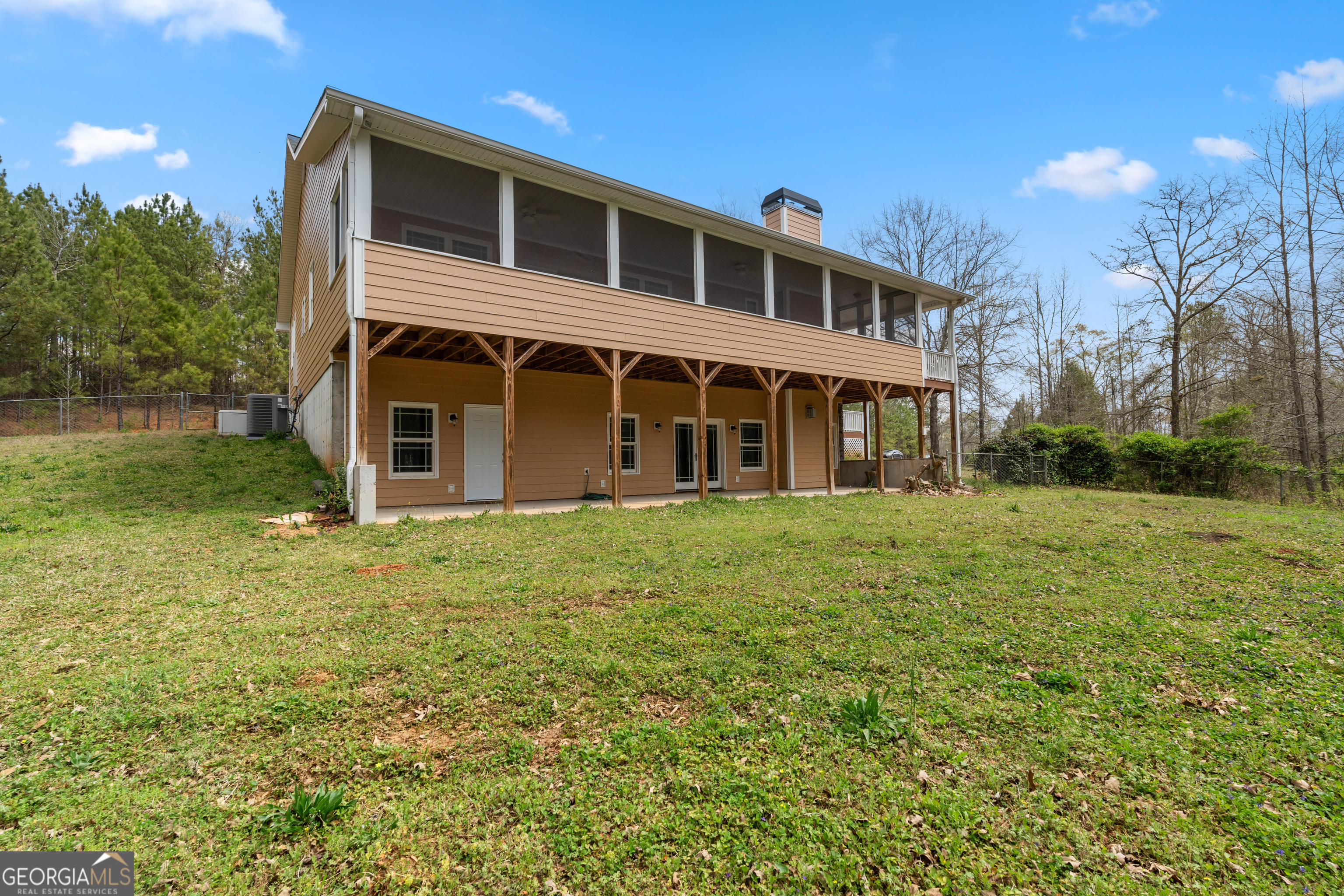 1229 Boggus Road Franklin, GA 30217 - Photo 45 of 68 a front view of a house with a garden