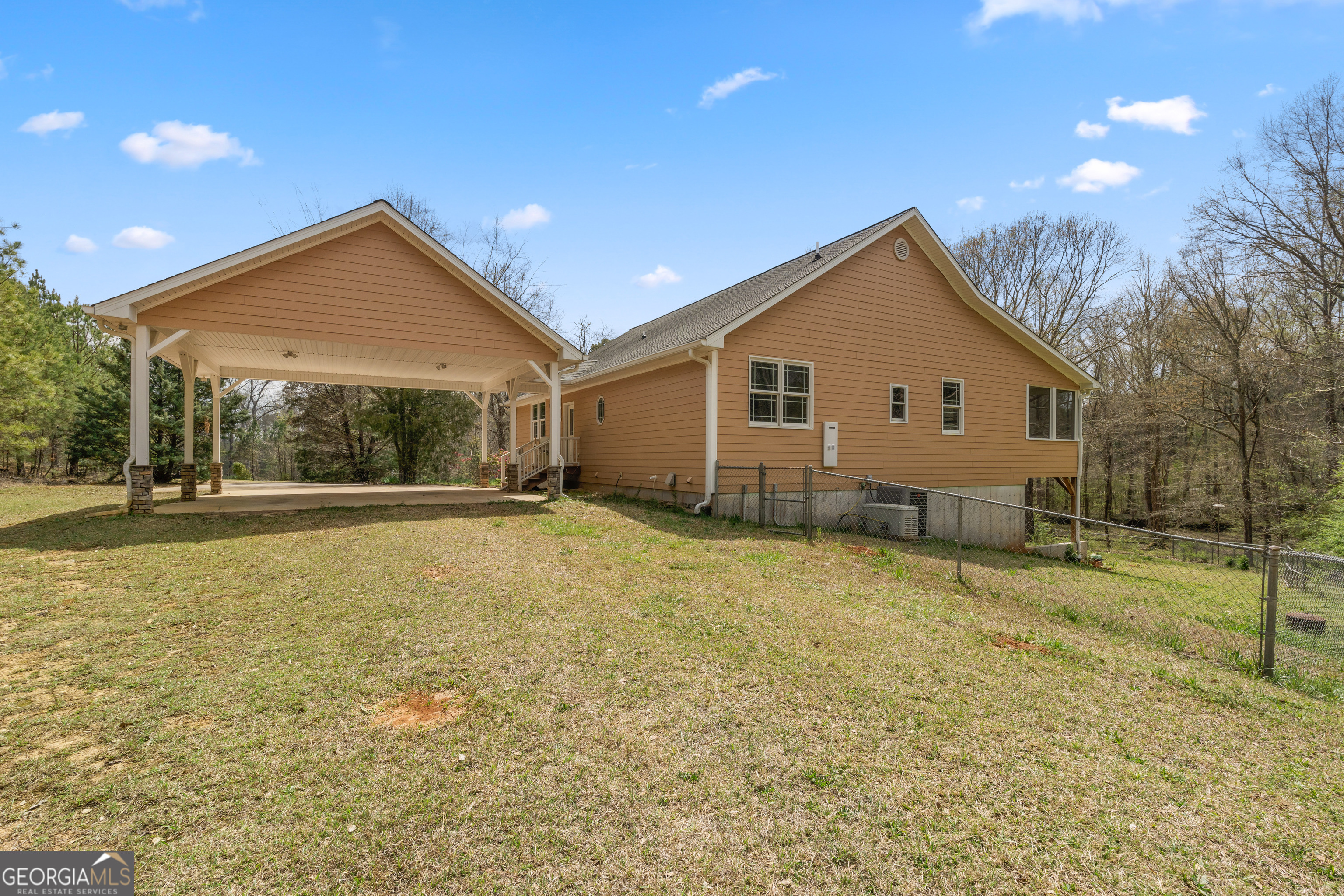 1229 Boggus Road Franklin, GA 30217 - Photo 48 of 68 a view of a house with a backyard and a tree