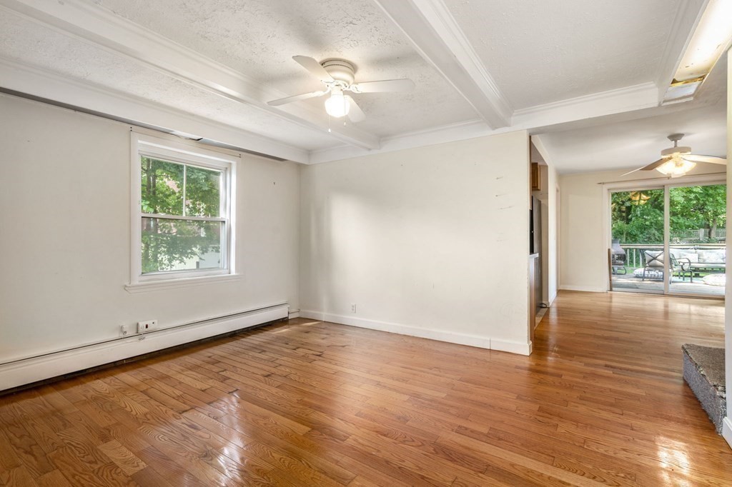 21 Fayette Street Watertown, MA 02472 - Photo 13 of 25 a view of an empty room with wooden floor and a window