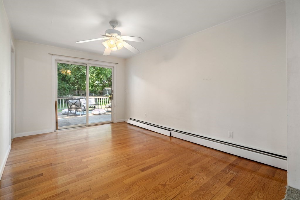 21 Fayette Street Watertown, MA 02472 - Photo 19 of 25 a view of an empty room with wooden floor and a window