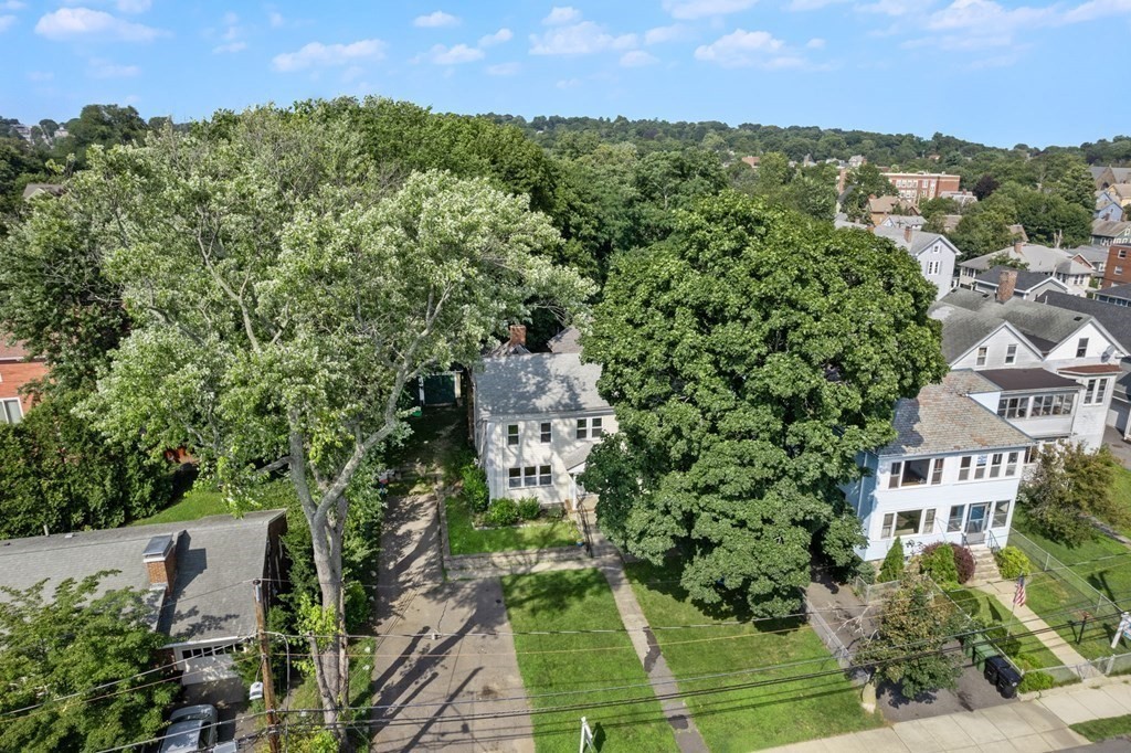 21 Fayette Street Watertown, MA 02472 - Photo 2 of 25 an aerial view of a house with a yard and lake view