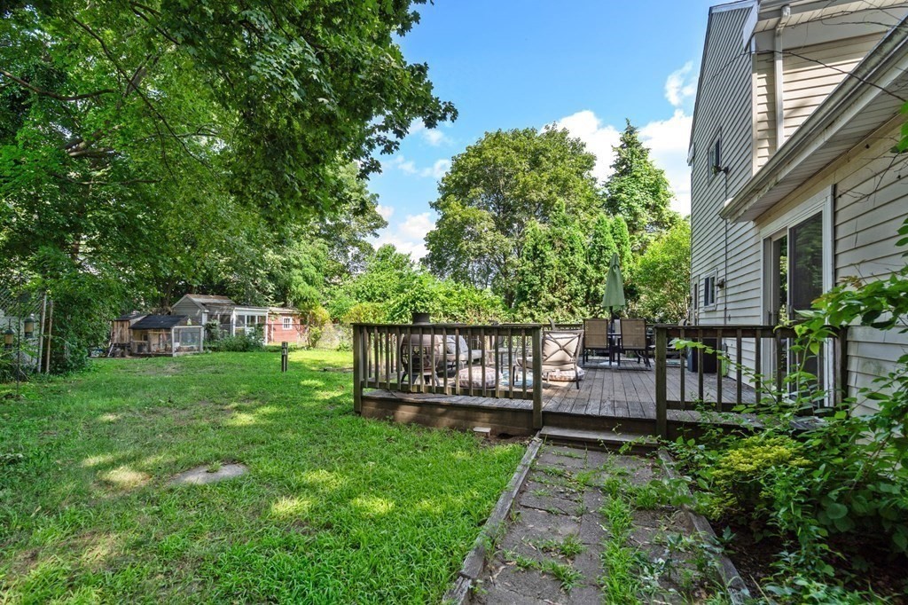 21 Fayette Street Watertown, MA 02472 - Photo 22 of 25 a view of a chair and tables in the backyard