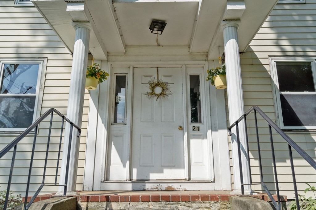 21 Fayette Street Watertown, MA 02472 - Photo 24 of 25 a front view of a house with a garden