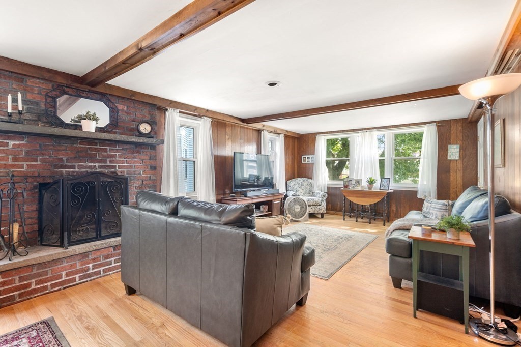 21 Fayette Street Watertown, MA 02472 - Photo 6 of 25 a living room with furniture and a fireplace