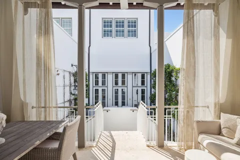 a view of multiple houses with a patio