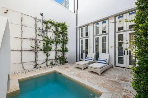 a view of house with a swimming pool