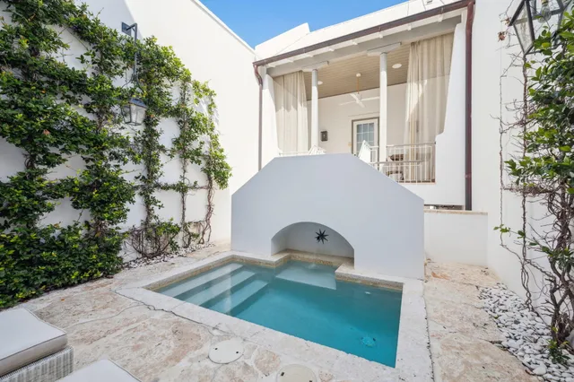 a view of a hallway view with wooden floor and staircase