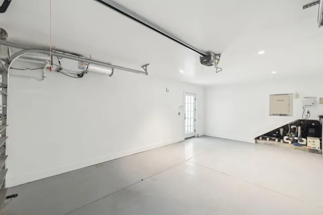 a bedroom with a bed and a chair