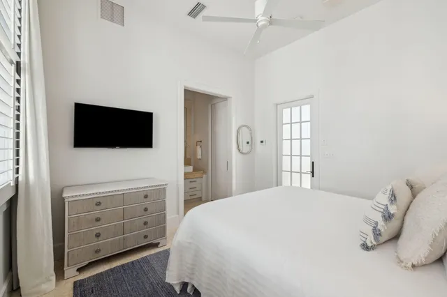 a bedroom with a bed and a couch