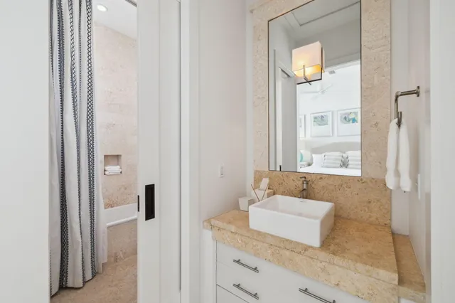 a bedroom with two bed and a flat screen tv