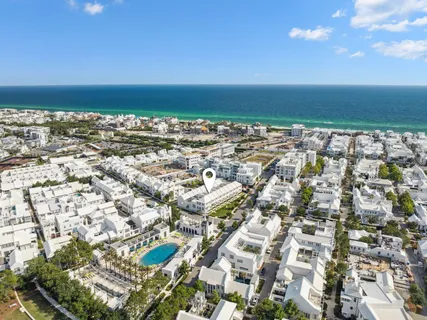 an aerial view of residential building and ocean