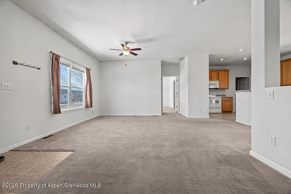 a view of an empty room with a window