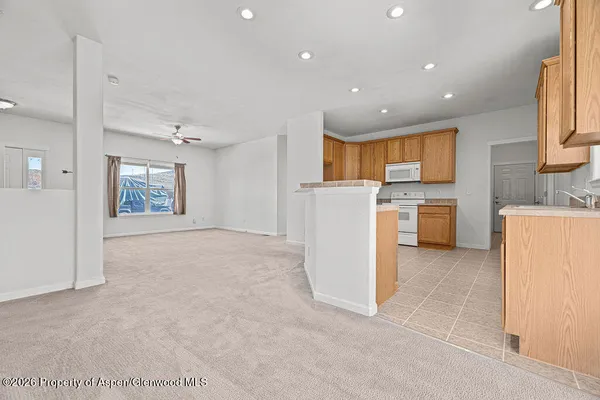 a view of a kitchen with appliances and cabinets