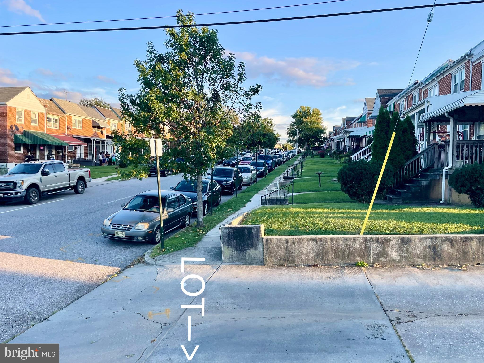5905 O Donnell Street Baltimore, MD 21224 - Photo 7 of 9 a front view of a house with garden