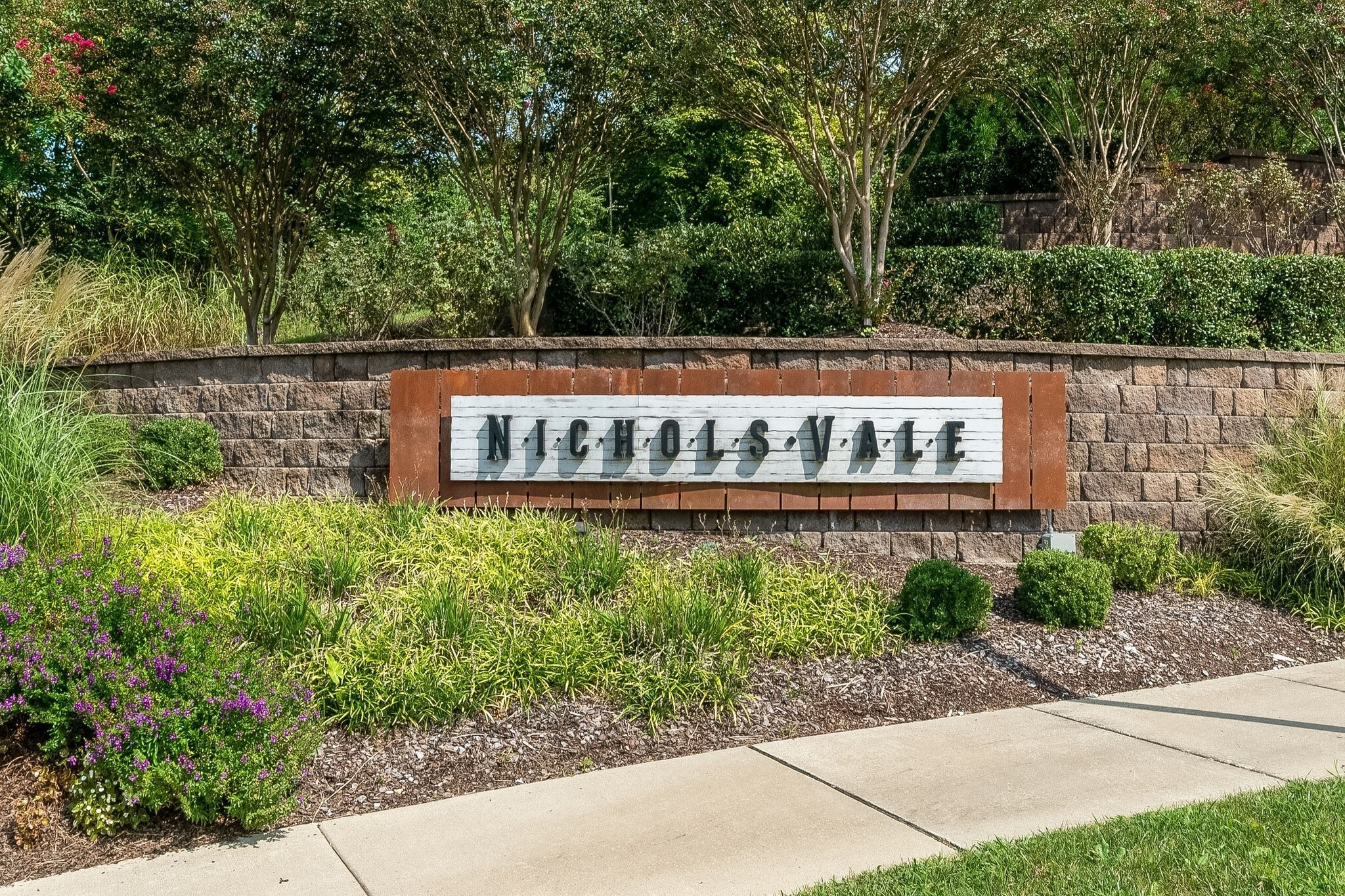 1306 Ardmore Ln Mount Mount Juliet, TN 37122 - Photo 3 of 41 a street sign that is sitting in the garden
