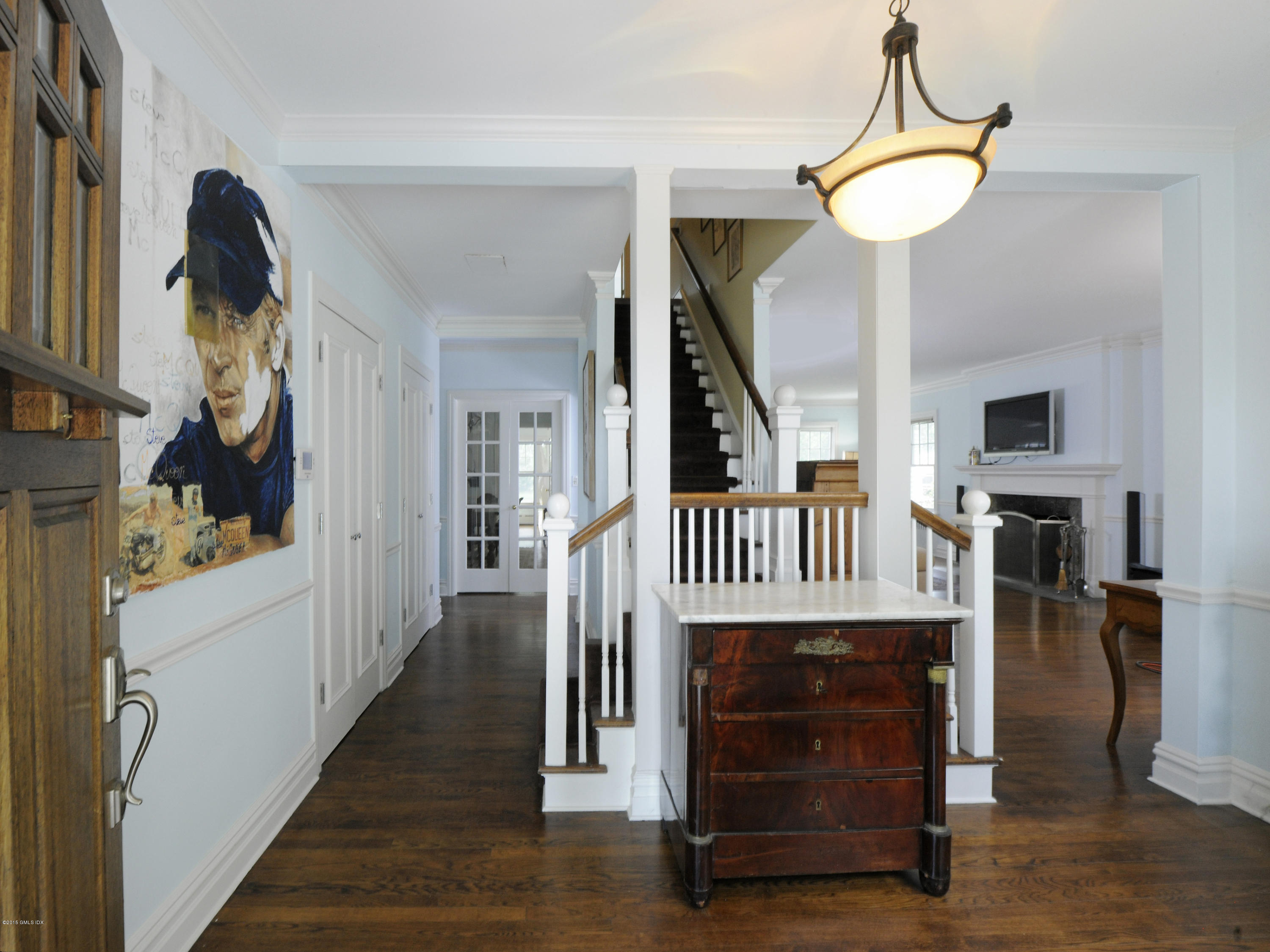 48 Locust Road Greenwich, CT 06831 - Photo 16 of 20 a view of a hallway with the wooden floor and staircase